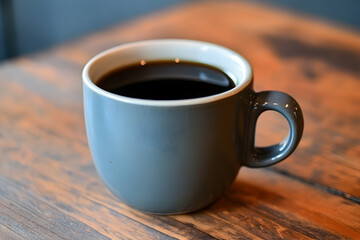 Obraz premium Dark, rich coffee in a gray ceramic cup.