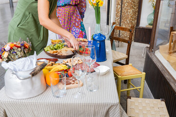 Outdoor dining setup with colorful fruit and elegant decor
