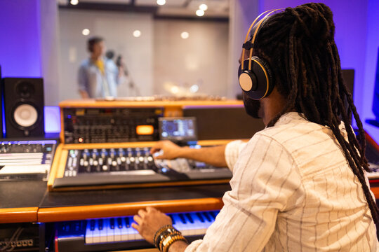 Music Producer at Work in Professional Recording Studio