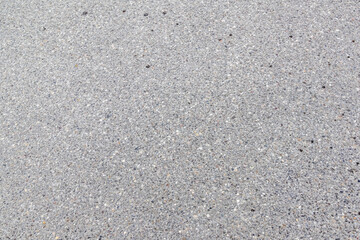 Close-up of textured asphalt road surface..