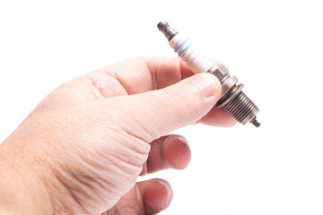 Spark plug for cars in hand isolated white background