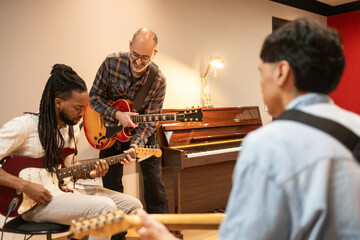 Musicians Collaborating in a Creative Recording Studio Session