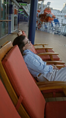 Woman relaxing on cruise ship deck with ocean view, enjoying leisure time outdoors on sunny day,...