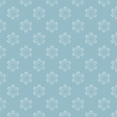 Seamless blue winter pattern with white outlined snowflakes and tiny polka dots, cute Christmas background ideal for wrapping paper, fabric, gift packaging and festive designs.