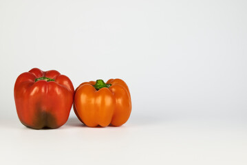 Diverse and colorful variety of bell peppers found naturally in the regions of Peru displayed on a white background