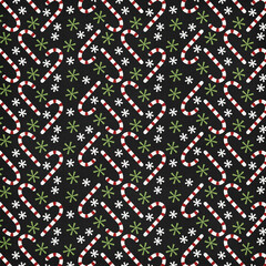 Seamless black Christmas pattern with red and white candy canes, green stars and white snowflakes, fun holiday background for wrapping paper, fabric, gift packaging and decor.