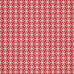 Seamless red Christmas pattern with white stylized snowflakes and green centers, festive winter background perfect for wrapping paper, fabric, gift packaging, scrapbooking and holiday decor.