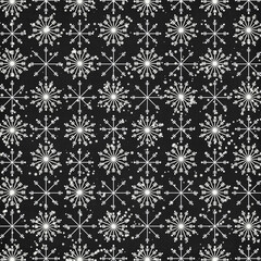 Seamless black winter pattern with white snowflakes and falling snow, elegant Christmas background perfect for wrapping paper, fabric, gift packaging, scrapbooking and holiday decor.
