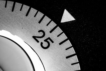 Monochrome Close-Up of a Vintage Mechanical Timer Dial at 25 Seconds