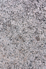 Grainy asphalt texture with white residue
