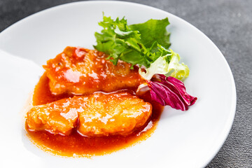 Fish tomato sauce white fish fillet dish organic fresh tasty gourmet food background on the table rustic food top view copy space