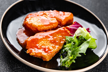 Fish tomato sauce white fish fillet dish organic fresh tasty gourmet food background on the table rustic food top view copy space
