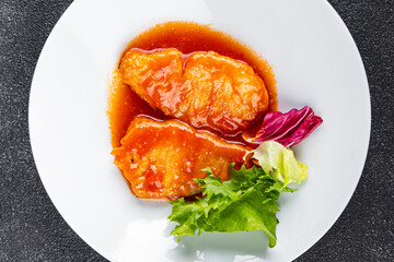 Fish tomato sauce white fish fillet dish organic fresh tasty gourmet food background on the table rustic food top view copy space