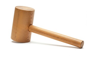 A wooden mallet with a cylindrical head and handle lying on a white surface in a studio shot