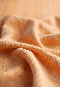Macro shot of knit and woven textiles in warm tones