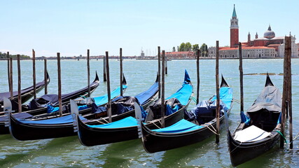 gondolas typical Venetian boats moored in the Giudecca canal in front of the church of San Giorgio Saint George in VENICE Island in Northern Italy © ChiccoDodiFC