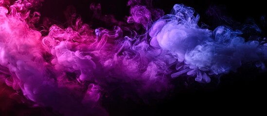Fototapeta premium Abstract image of swirling blue, purple, and pink smoke on a black background. Suitable for creative backgrounds, digital art projects, or symbolic visuals representing fluidity and mystery.