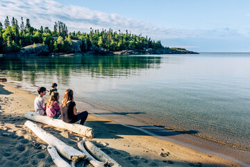 Family on the shores of Lake Superior, Pukaskwa National Park, Ontario, Canada