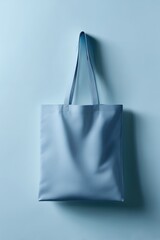 stylish blue tote bag on minimalist pastel background, highlighting simplicity and functionality for eco-conscious shoppers. perfect for daily errands or casual outings.