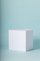 White cube on blue background. Minimal mock up  for your products.
