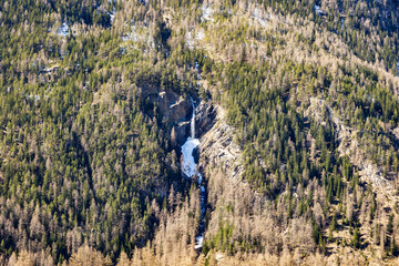 High alpine waterfall in melting snow, Ötztal, Austria, 20 March 2025..