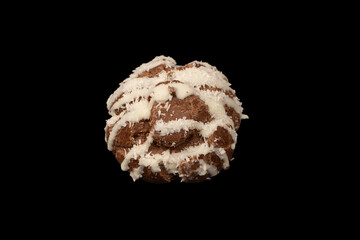 Profiteroles with coconut cream on a black background.