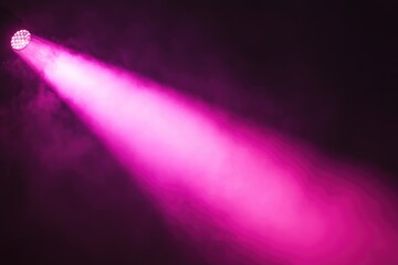A vibrant pink spotlight cuts through the darkness, illuminating a smoky atmosphere.