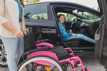 Young woman with cerebral palsy prepares to exit car with assistant’s help - Seated in vehicle,...