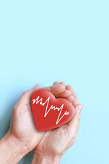 hands holding a red heart
