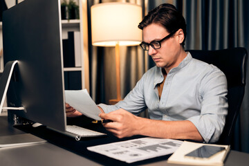 Smart businessman analyzing business paragraph dynamic database marketing analysis plan surrounded...