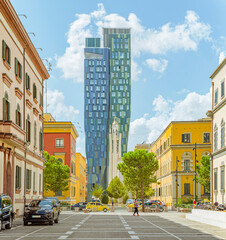 Obraz premium Tirana street scene with colorful buildings and modern tower, Albania