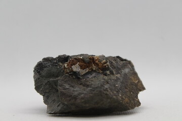 Pyrite in a rock isolated on a white background. natural silver pyrite gem on white background. Pyrrhotite or Pyrite from Baska, Frydek Mistek, Czech republic 