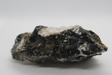 Pyrrhotite mineral isolated on a white background. Pyrite mineral isolated on a white background. Pyrrhotite or Pyrite from Baska, Frydek Mistek, Czech republic 