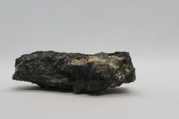 Pyrite in a rock isolated on a white background. natural silver pyrite gem on white background. Pyrrhotite or Pyrite from Baska, Frydek Mistek, Czech republic 