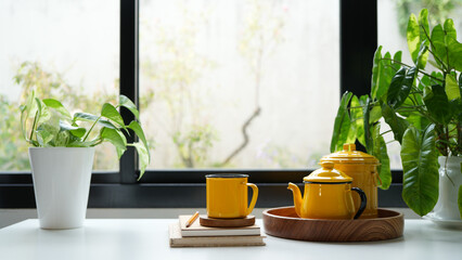 Yellow tea pot and cup set, indoor drinking