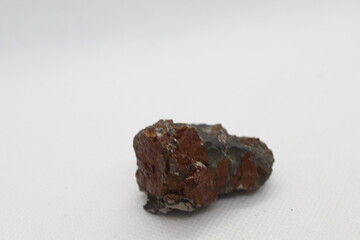 Pyrrhotite mineral isolated on a white background. Pyrite mineral isolated on a white background....