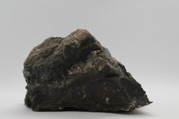 Pyrrhotite mineral isolated on a white background. Pyrite mineral isolated on a white background....