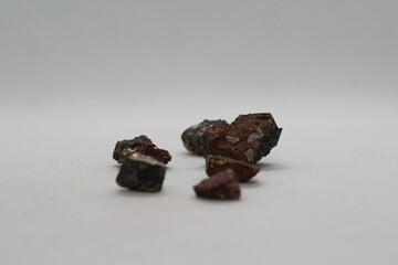 Pyrrhotite mineral isolated on a white background. Pyrite mineral isolated on a white background....