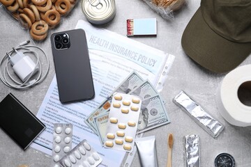Survival kit. Different emergency supplies on grey table, flat lay