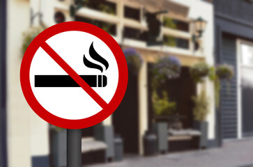 No Smoking sign on city street. Space for text