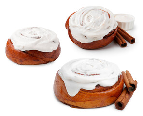Tasty cinnamon rolls with cream and sticks isolated on white, set