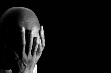 praying to god with hands together Caribbean man praying with black background with people stock photo stock image
