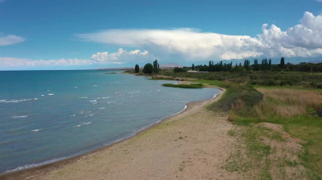 This drone footage showcases the tranquil beauty of Assyk Kul Lake, highlighting its pristine waters and natural surroundings in Kyrgyzstan.
