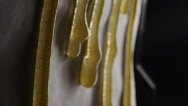 Freshly pressed medical cannabis, hash, live rosin, macro. Concentrate or cannabis oil obtained by heat-pressing fresh marijuana auto-flowering plants. Production of CBD isolate