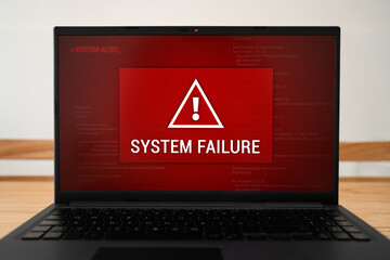 Laptop screen with urgent system failure notification. Concept of critical error with data loss.