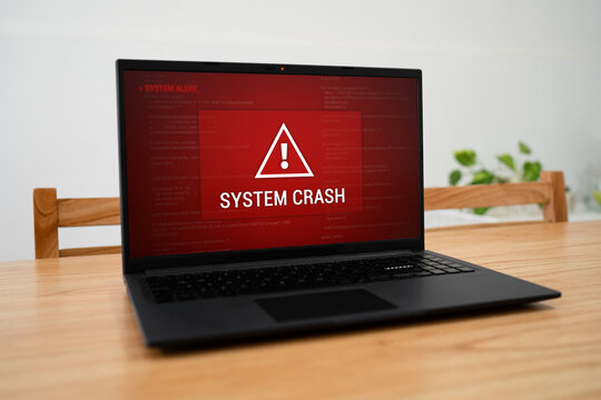 System crash notification on laptop screen. Concept of computer system failure.