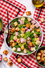 Parisian salad with cheese, ham and croutons