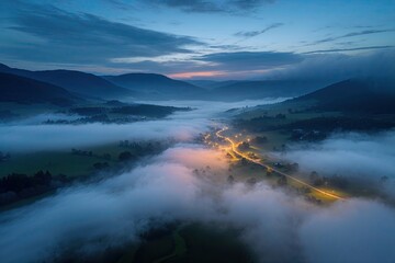 Fototapeta premium Stunning Aerial Views of a Foggy Valley at Twilight