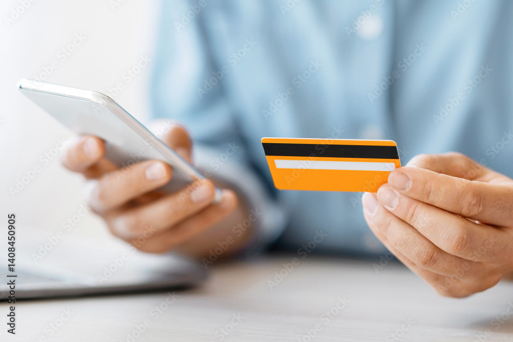 Aufkleber unrecognizable man using smartphone and credit card in office, paying bills online, using mobile app