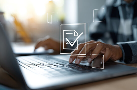 Person typing on a laptop with digital checkmark overlay in a bright office setting